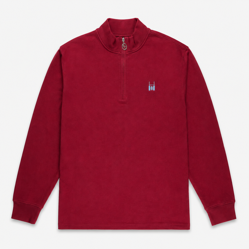 A maroon quarter-zip pullover sweatshirt with a small embroidered logo on the left chest, displayed flat against a light gray background.