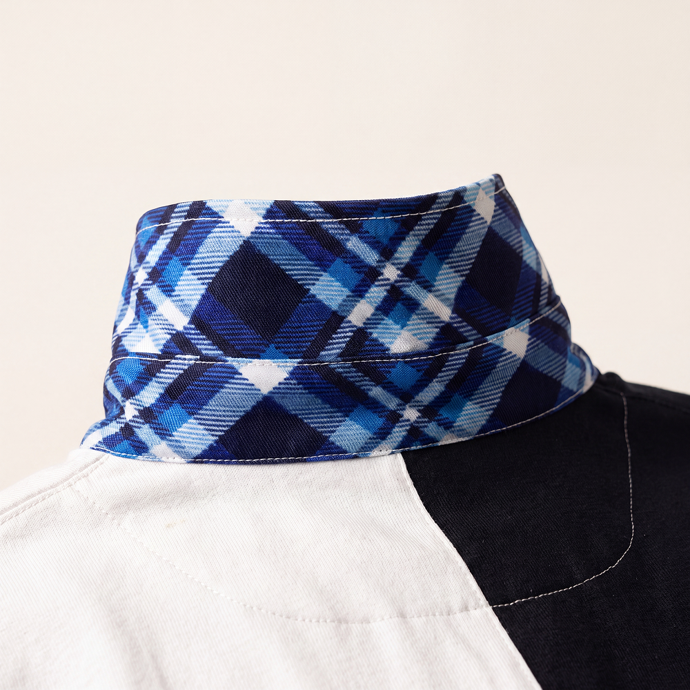 Close-up of the tartan detail under the collar of the Rugby Culture Scotland Rugby Polo