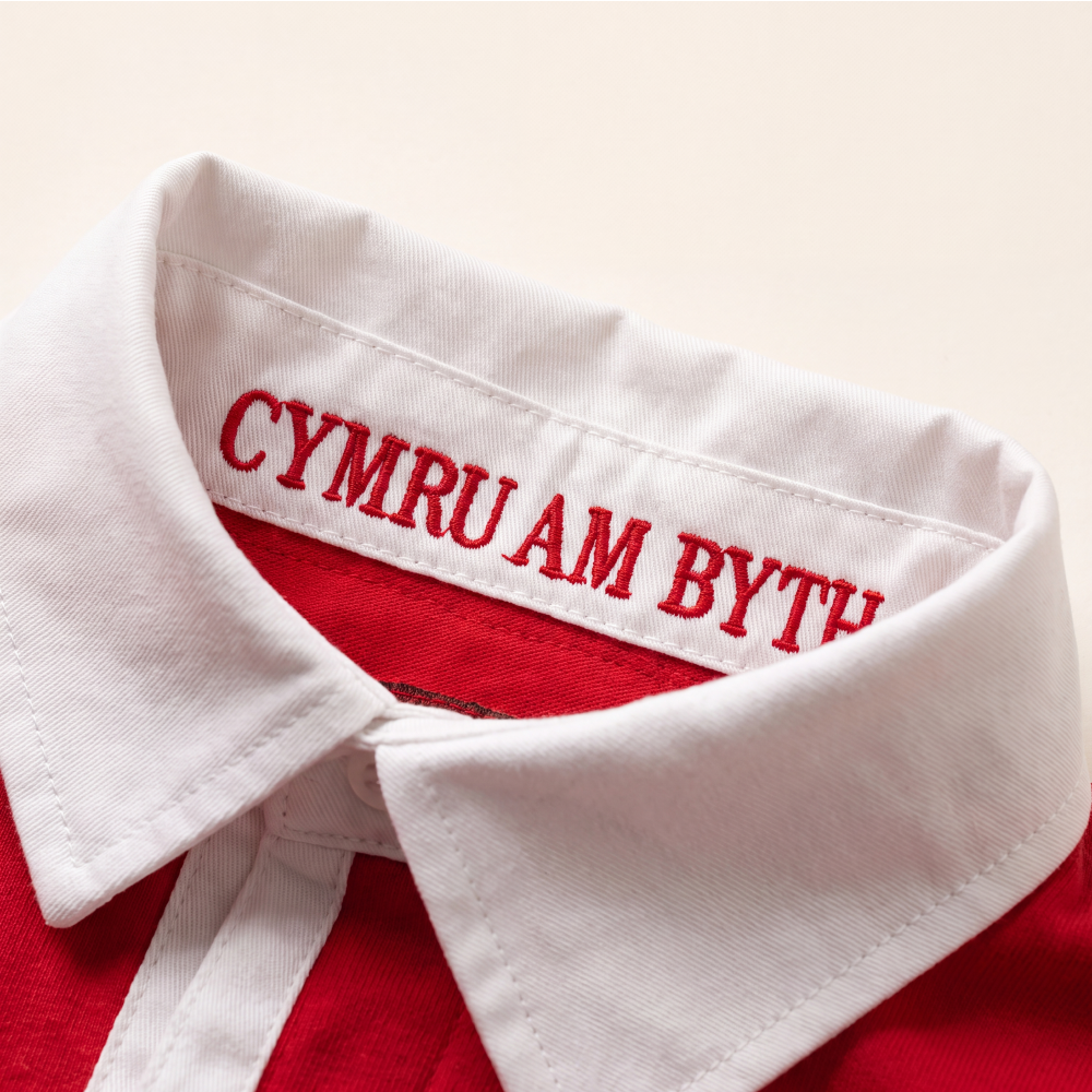 Close-up of 'Cymru am Byth' embroidered under the collar of the Rugby Culture Wales Rugby Polo