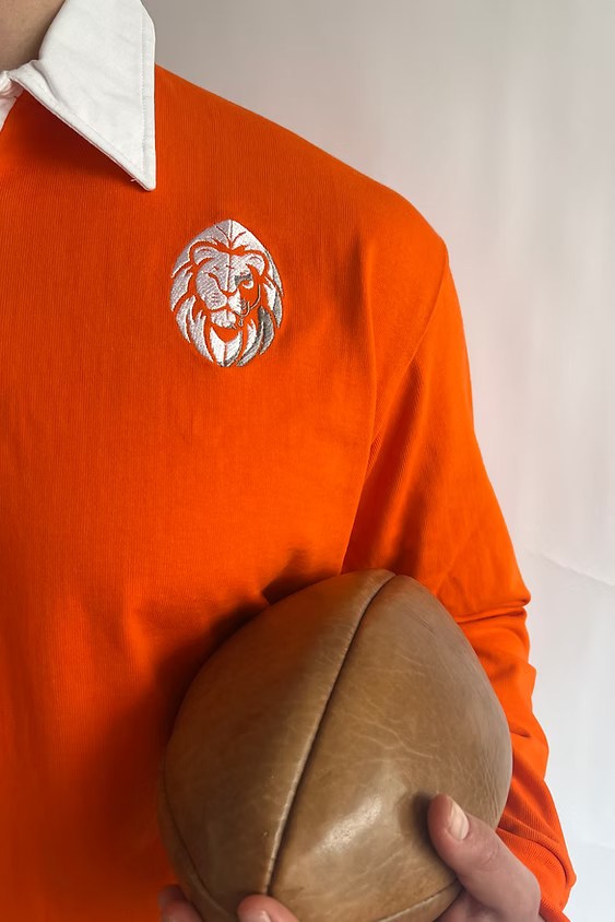 Close-up of the Dutch lion crest on the Rugby Culture Kids Netherlands Rugby Polo