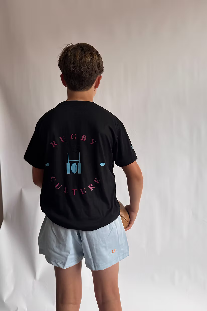 Rugby Culture Kids Black T-Shirt worn by a young player, back view showing the back print