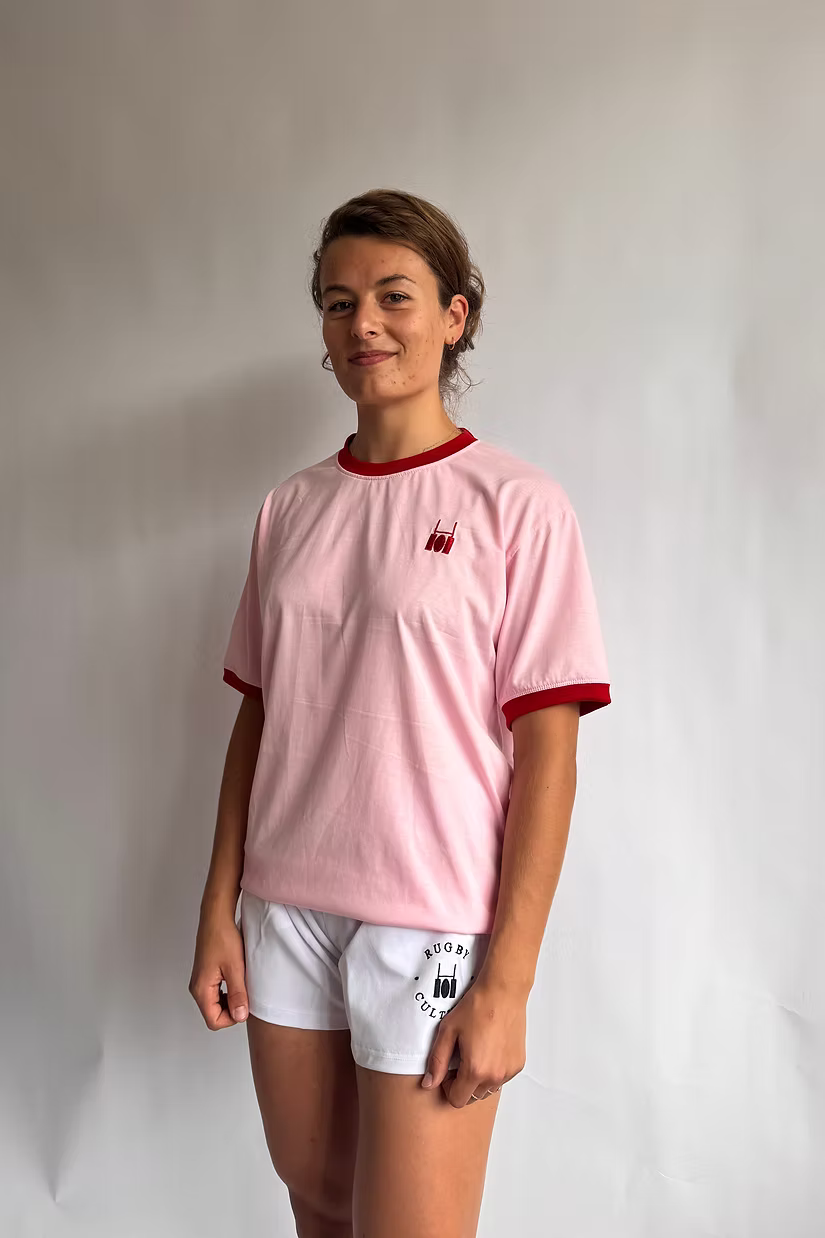 Rugby Culture Pink & Red Logo T-Shirt worn by a female model, relaxed front view
