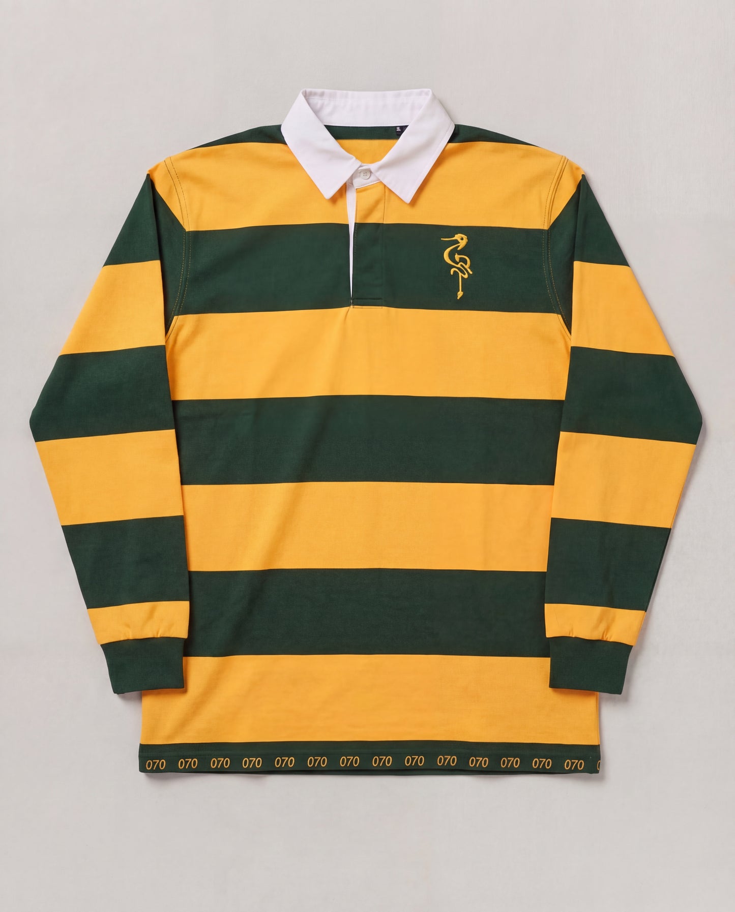 Green and yellow striped rugby shirt with a logo on a gray background