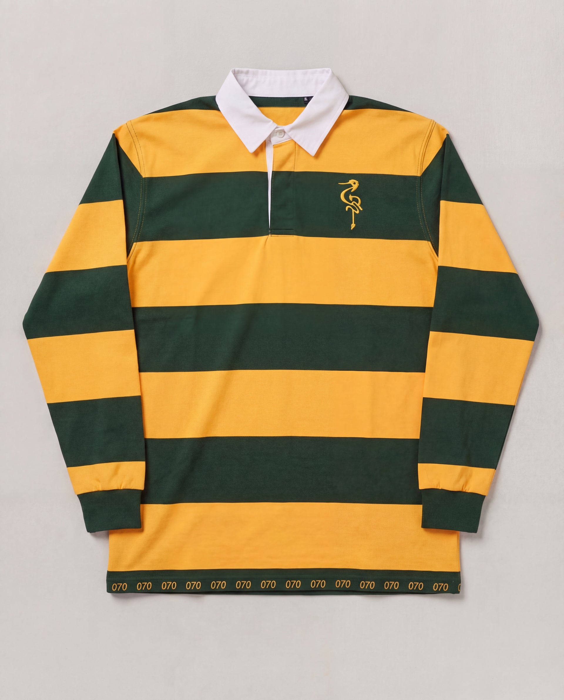 Green and yellow striped rugby shirt with a logo on a gray background