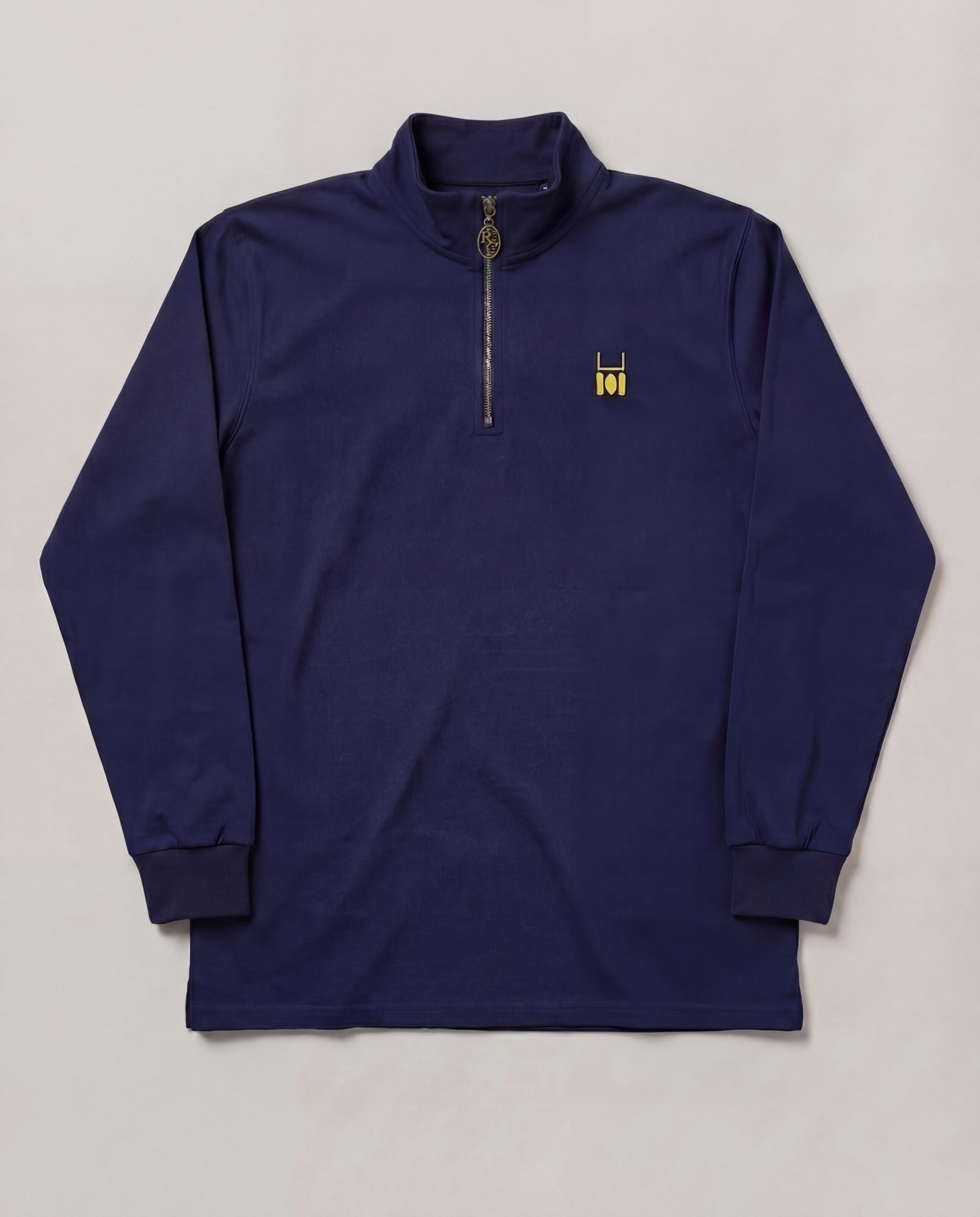 Navy long-sleeve shirt with a small logo on a light gray background