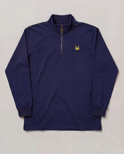 Navy long-sleeve shirt with a small logo on a light gray background