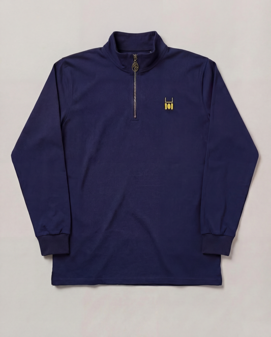 Navy long-sleeve shirt with a small logo on a light gray background